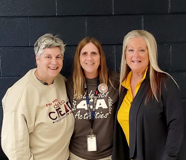 Mrs. Van I, Mrs. Scopas, and Mrs. Hagerty all pose for a picture in the cafeteria.

