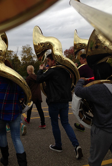 Junior Robert Lindsay did not want to throw out his fro-yo, so he marched with it.