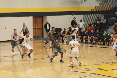 Jermaine Jackson Jr. (11) of Dakota guards Fraser's Sebastian Tavalieri (20) during February 13th's matchup.