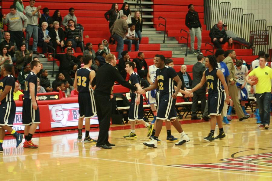 Trevor Fudge (42) slaps his assistant coach's hand after huge win.