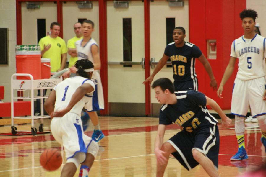 Fraser's Sebastian Tavalieri (20) guards Tavin Allison (1) of L'Anse Creuse.