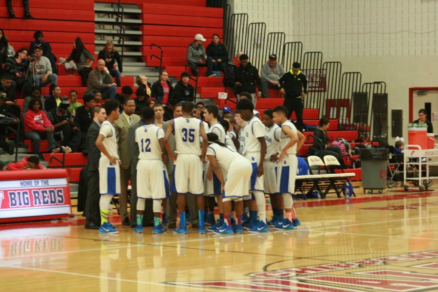 L'Anse Creuse huddles during the first quarter after a Fraser timeout.