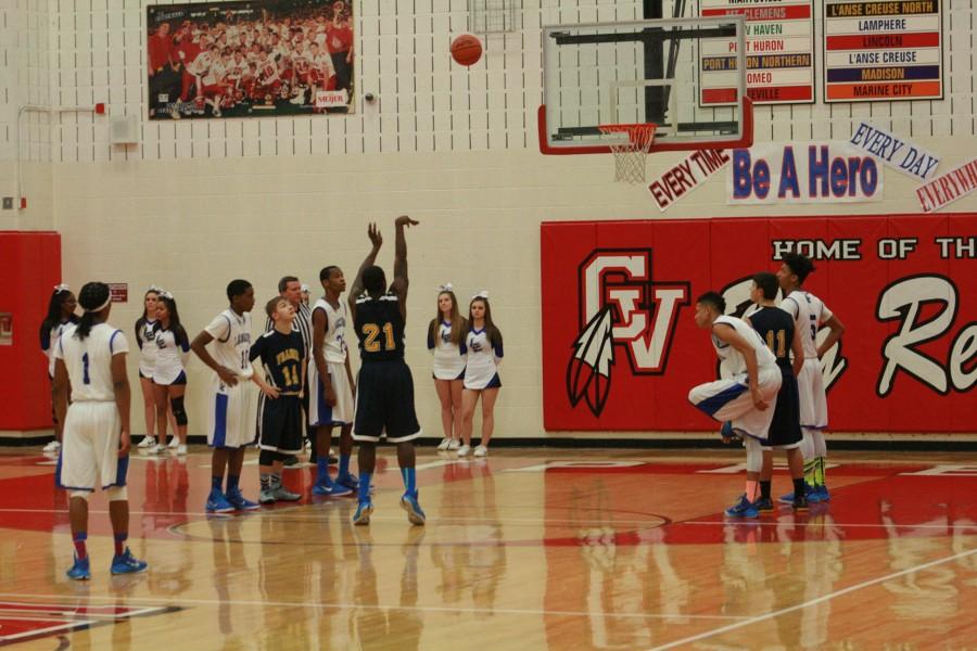 Shawn Jackson (21) shooting and making one of his many free throws against L'Anse Creuse.