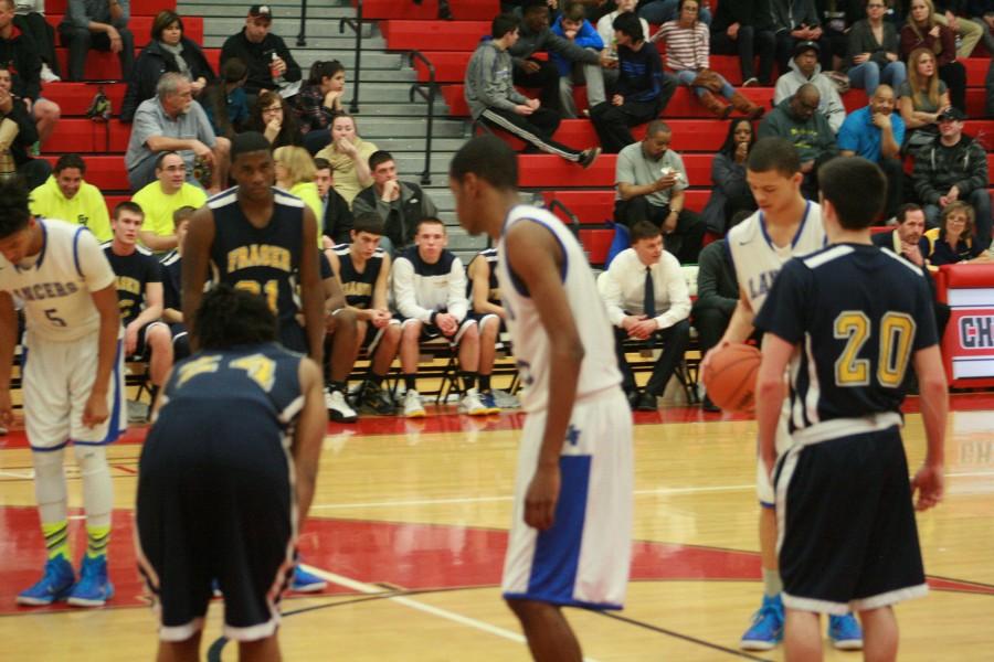 L'Anse Creuse's Adam Samuel (21) shooting a free throw during the game March 9th.