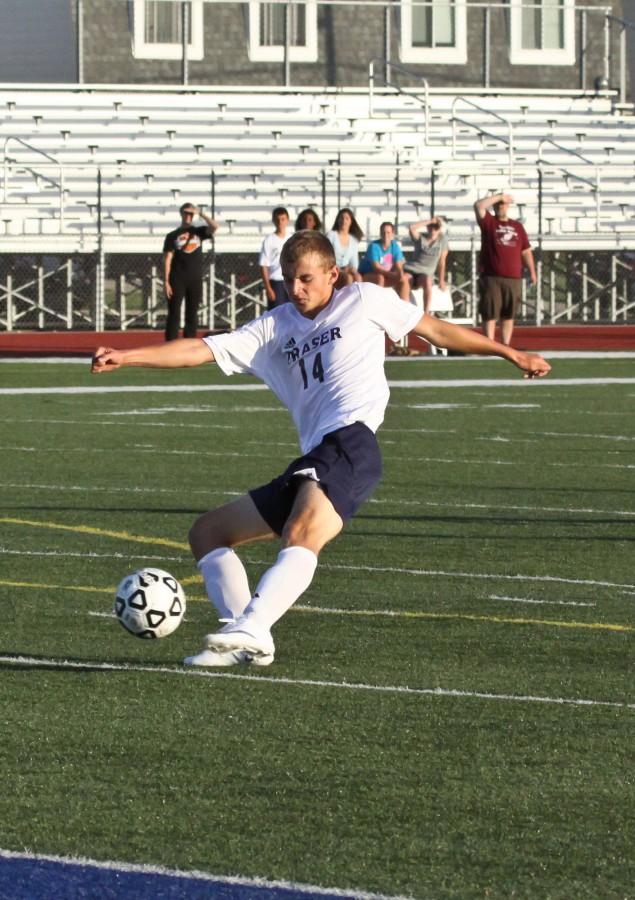 Matthew Lentine strikes the ball, sending it flying towards the net.