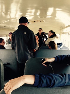 The girls are ecstatic to see their coach bring the six pizza boxes and bread onboard. They soon learned that only four of the boxes had pizza.