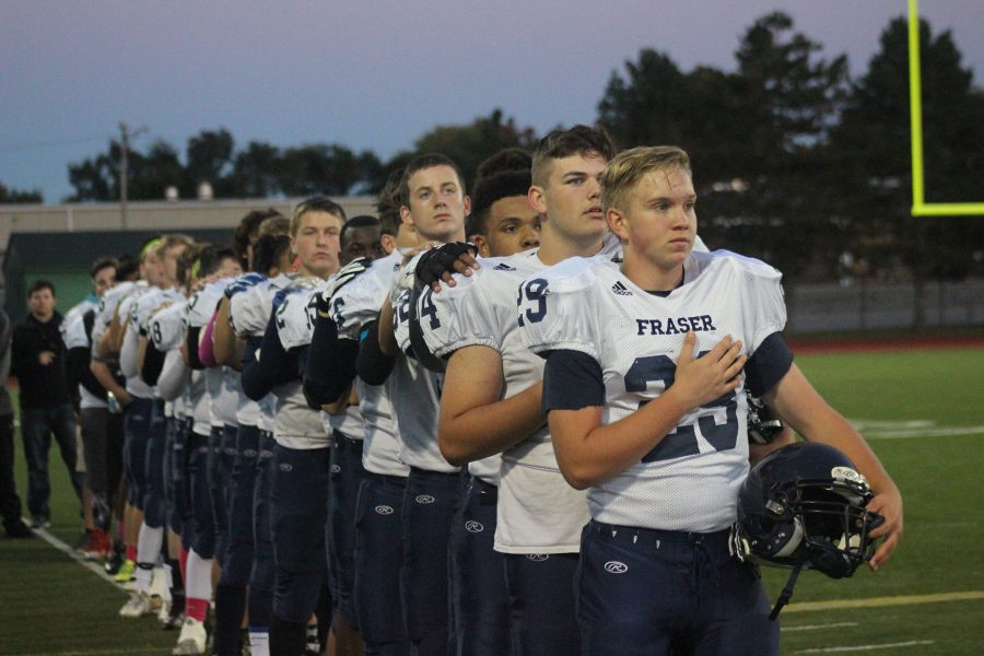 JV Football lines up for the national anthem.