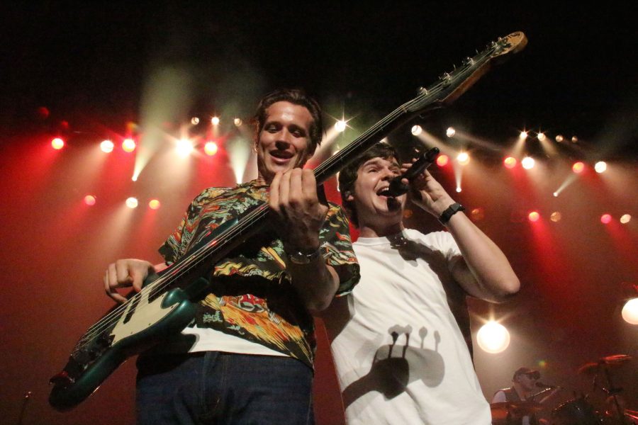 Lead singer Lukas Forchhammer crosses the stage during "Drunk in the Morning" to meet up with bassist Magnus Larrson.