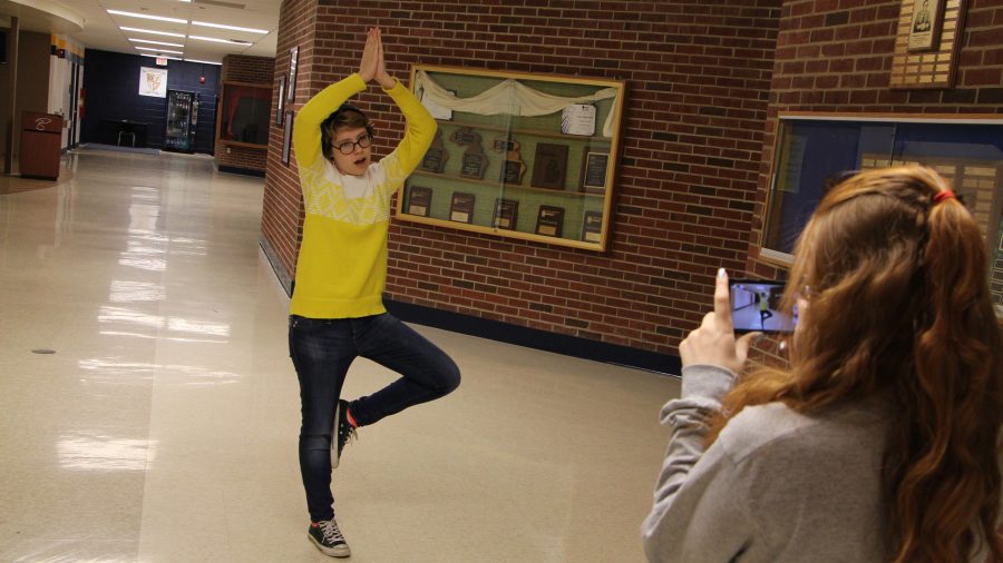 Senior Kiersten Tyler takes a Vine of Senior Sam Nork doing a yoga routine. 