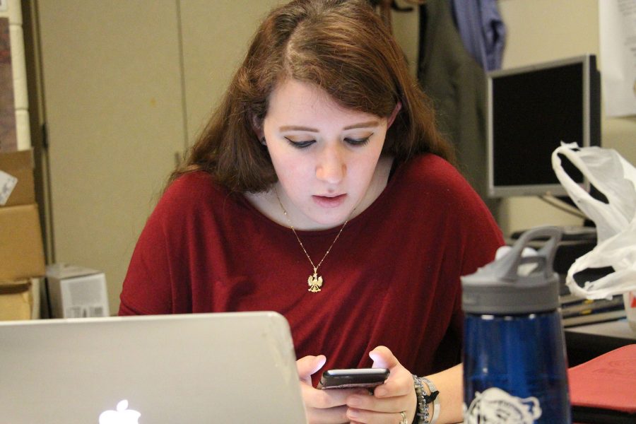 Senior Shelley Sawyer is on her phone, with a little bit of free time at the end of class Shelley sends a text. Shelley's phone provider is AT&T. Shelley sends about 100 text in a day.