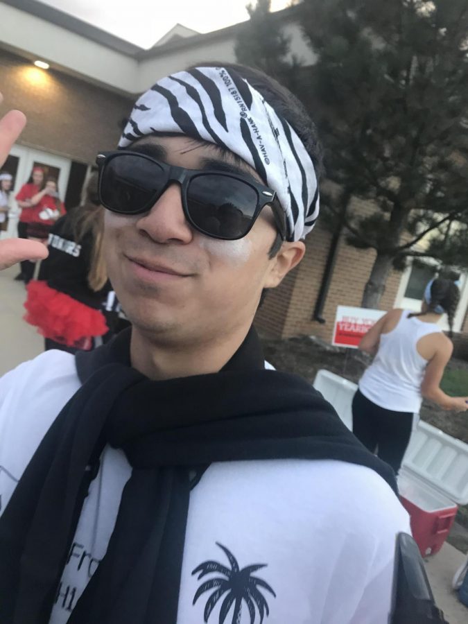 Richard Johnson, a senior, is waiting in line to get his well-earned hotdog meal after marching at the homecoming game. Richard plays the tenor saxophone and was the section leader of his section this marching season.
