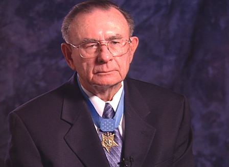 Marine Corps Pfc. Robert Simanek wears his Medal of Honor while discussing his actions in Korea. (Photo By: Library of Congress video still/Department of Defense.gov)