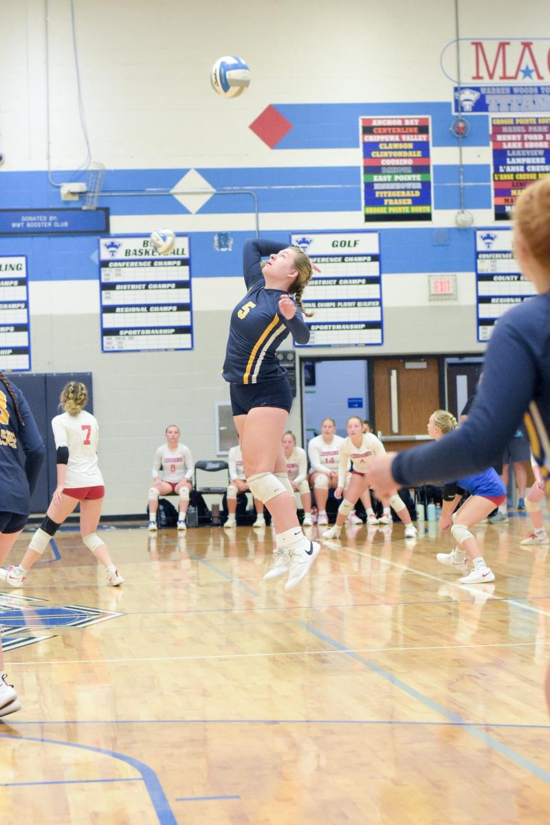 Taylor Dubay, number 5, getting ready to spike the ball back over the net.