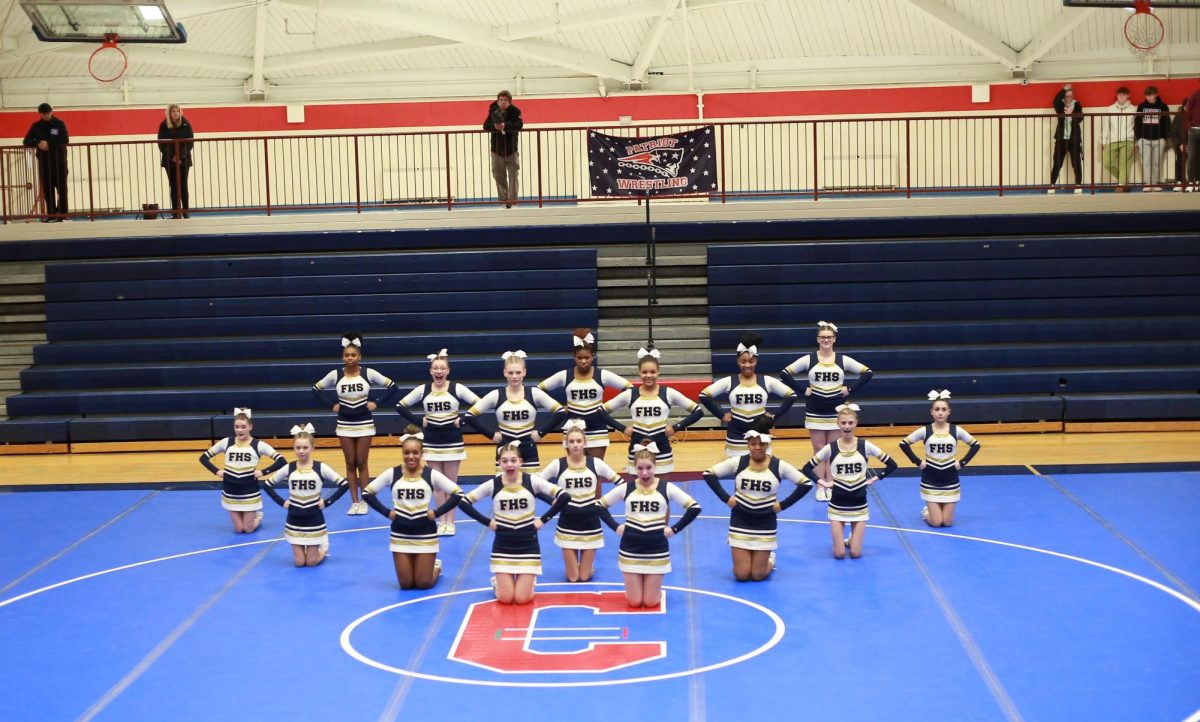 The cheer team getting ready for round 1